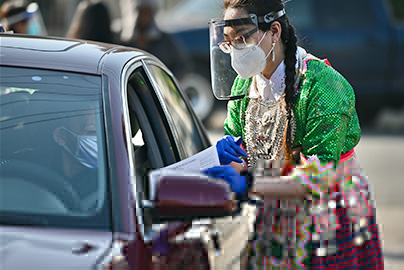 Hmong patient receiving vaccine through community drive-through and outreach in Sacramento